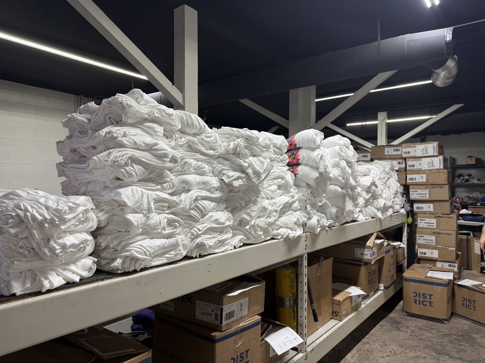 Large screen printing order stacked inside the Neon Moon production shop